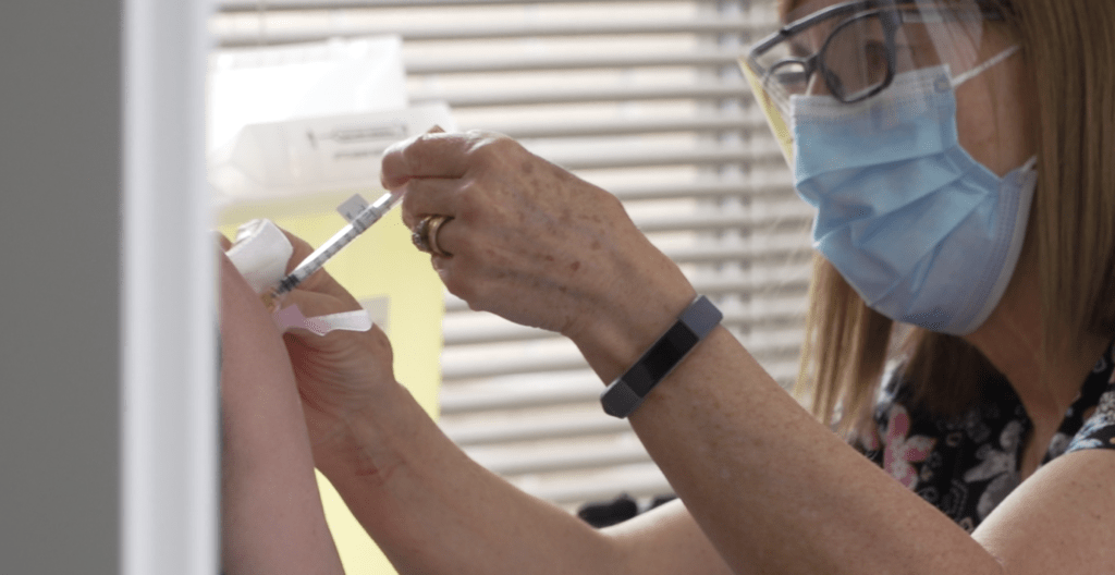 Nurse giving immunization
